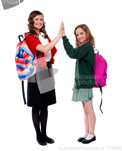 Image of Students giving high five to each other