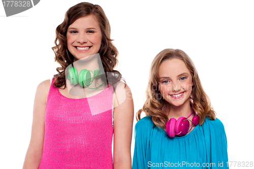 Image of Teenagers posing with headphones around neck