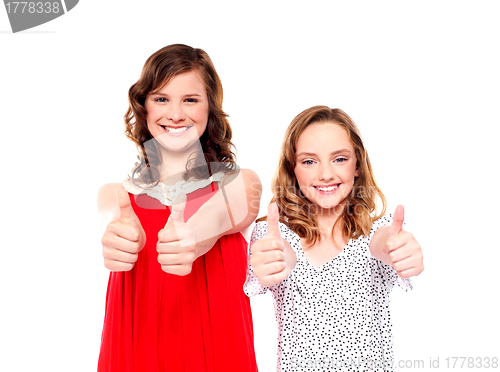 Image of Two friends gesturing thumbs up