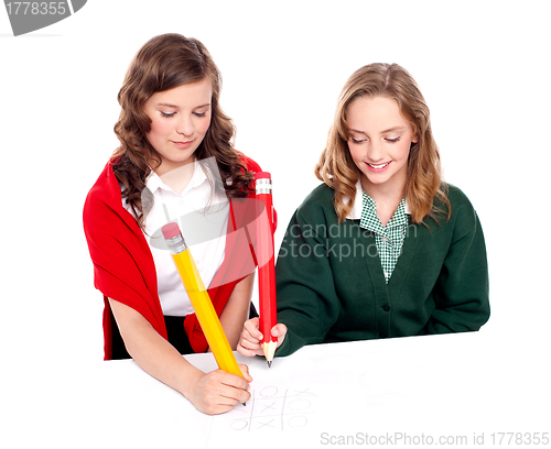 Image of Teenager friends playing ouths and crosses