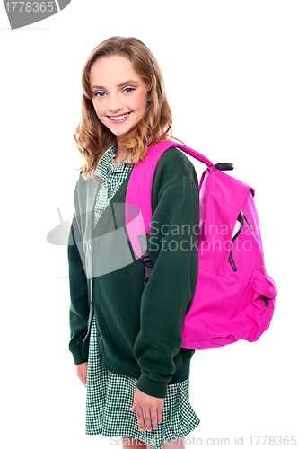 Image of School girl carrying bag on shoulders