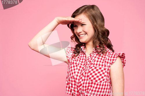 Image of Happy gorgeous girl looking far away