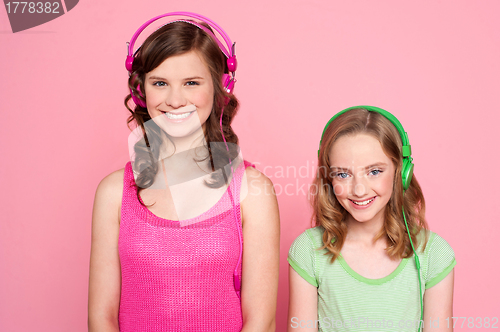 Image of Smiling girls posing with headphone