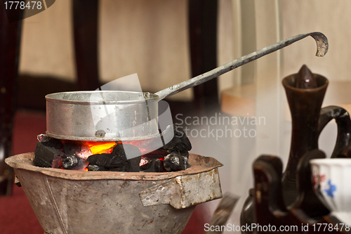 Image of Roasting raw coffee using coal