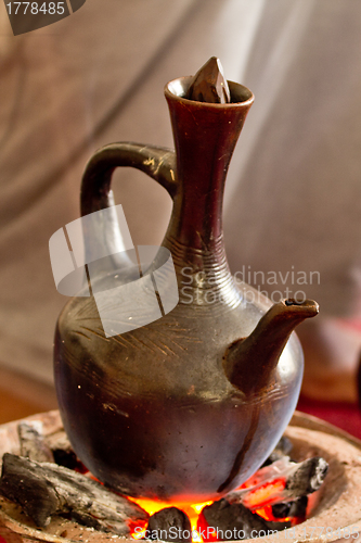 Image of Brewing coffee with Jebena using coal 