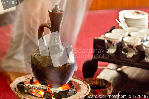 Image of Brewing coffee with Jebena using coal 