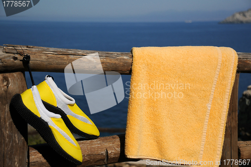 Image of Yellow Beach Shoes and Towel