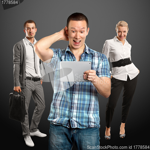 Image of Man With Touch Pad And Business Team 