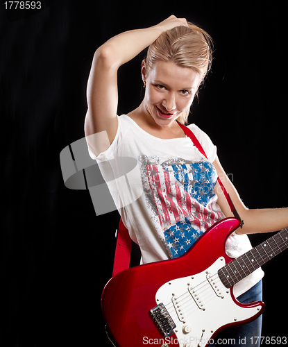 Image of Woman Playing the Guitar