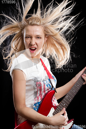 Image of Woman Playing the Guitar