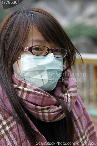 Image of Chinese sick girl wearing mask