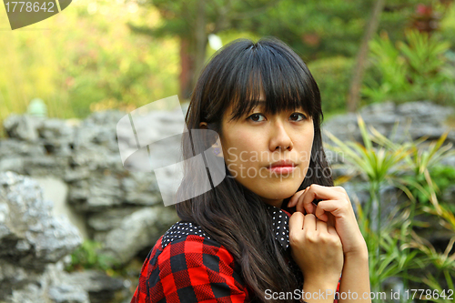 Image of Asian woman thinking