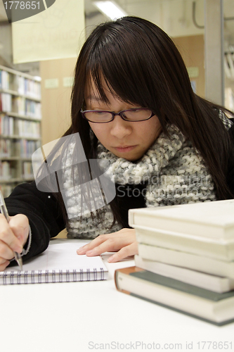 Image of Asian university student in library