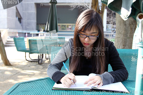 Image of Asian girl studying in university