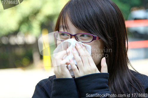 Image of Asian sneeze girl