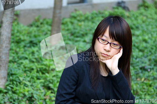 Image of Businesswoman thinking outdoor