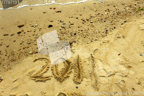 Image of 2011 on sand