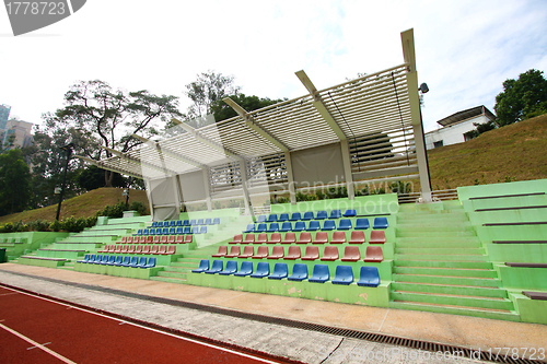 Image of Stadium chairs and running track