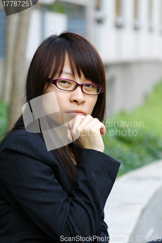 Image of Asian businesswoman thinking