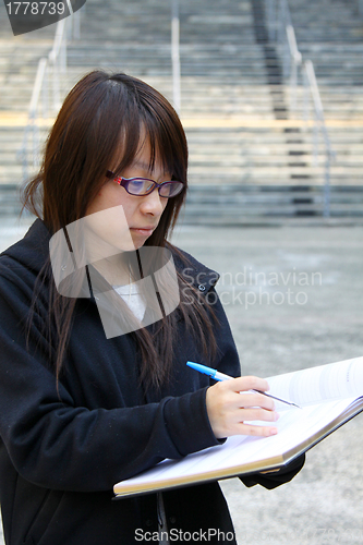 Image of Asian girl studying in university