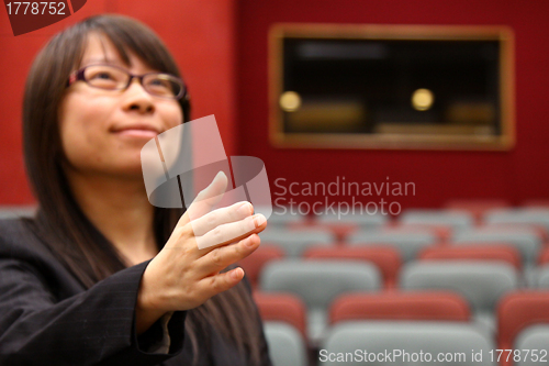 Image of Asian businesswoman with shaking hand