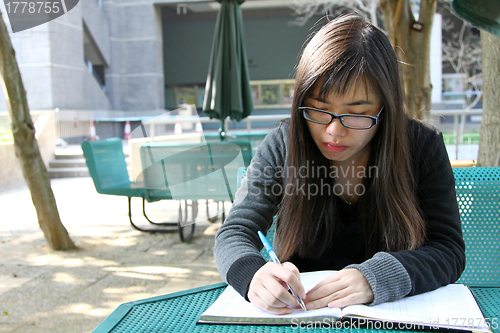 Image of Asian girl studying in university