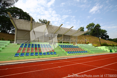 Image of Stadium chairs and running track