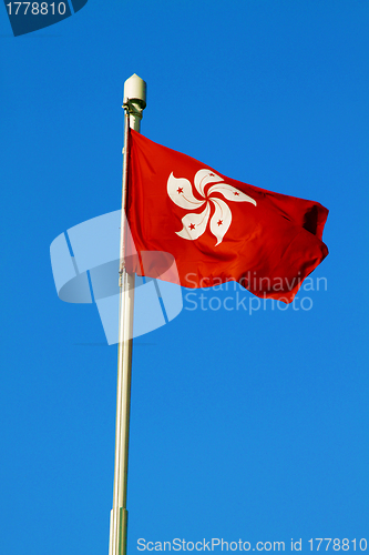 Image of Hong Kong SAR flag under blue sky