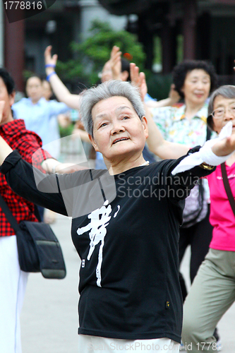 Image of Chinese women dancing on the street