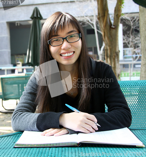 Image of Asian girl studying in university