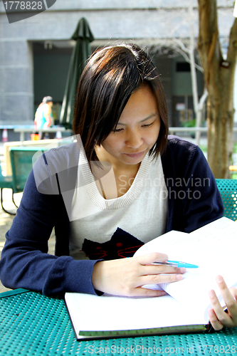 Image of Asian girl studying in university