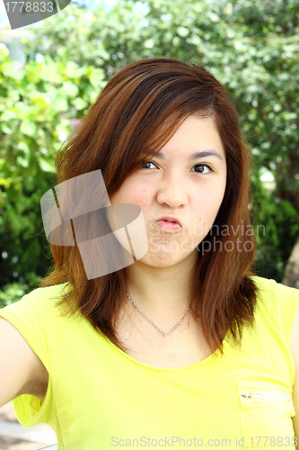 Image of Asian woman with angry face