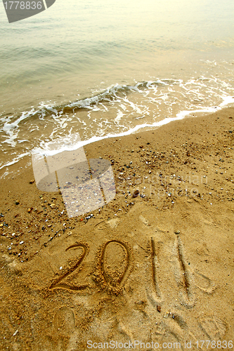 Image of 2011 on sand