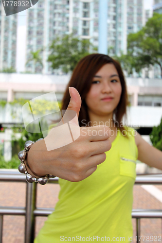 Image of Asian woman with thumbs up