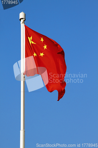 Image of China flag under blue sky