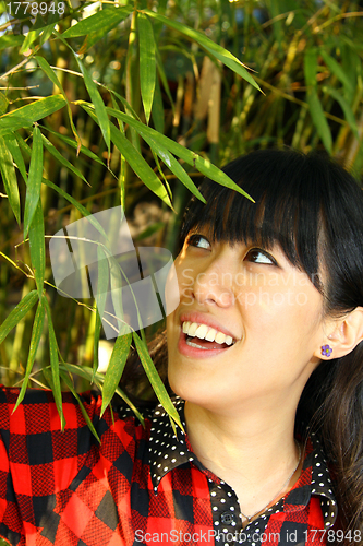 Image of Asian woman happy in nature