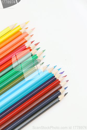 Image of Color pencils arrange on white background