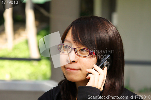 Image of Asian woman talking phone