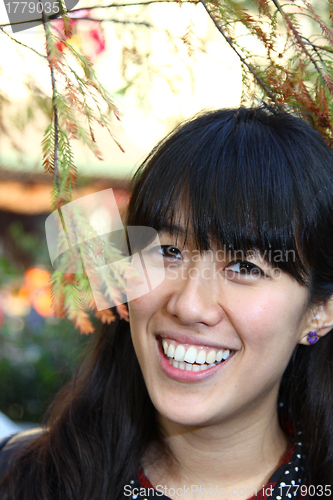 Image of Asian woman with big smile