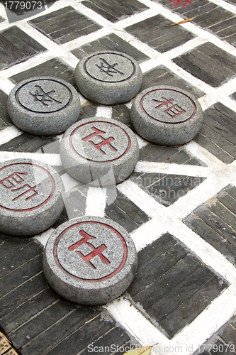 Image of Chinese chess on ground