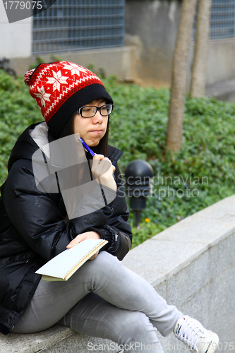 Image of Asian woman thinking