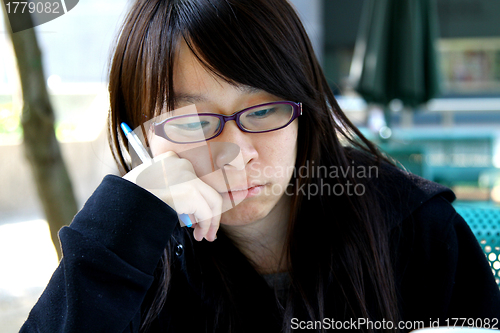 Image of Asian girl thinking