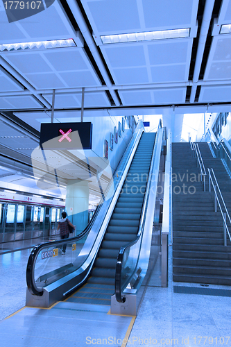 Image of Moving escalator in train station