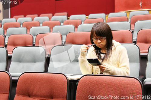 Image of Asian student studying in lecture 