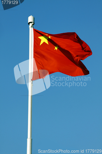 Image of China flag under blue sky