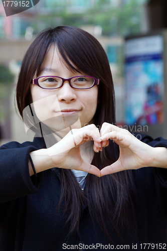 Image of Woman making a heart