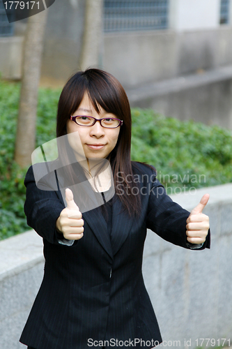 Image of Asian businesswoman with thumbs up