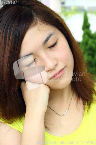 Image of Asian woman with sleepy face