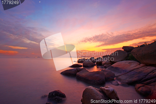 Image of Sunset over the ocean. Nature composition under long exposure.