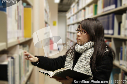 Image of Asian university student in library